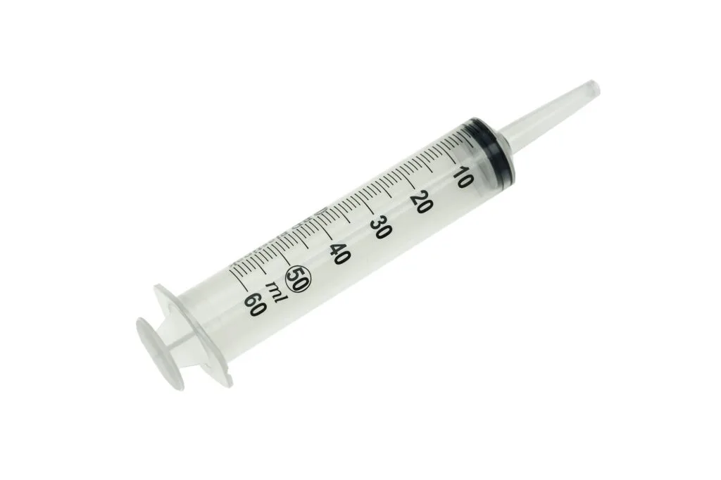 A disposable plastic medical syringe