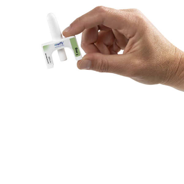Hand holding neffy needle free epinephrine nasal spray for anaphylaxis