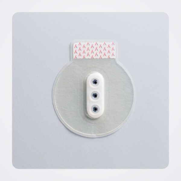 Round Bolin Chest Seal disc with three white valves and a red-striped pull tab