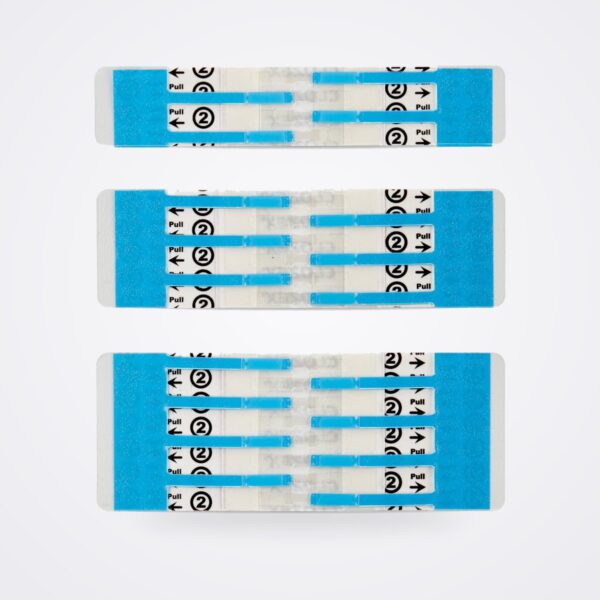 Three Clozex skin closure devices in different lengths with blue liners and pull tabs