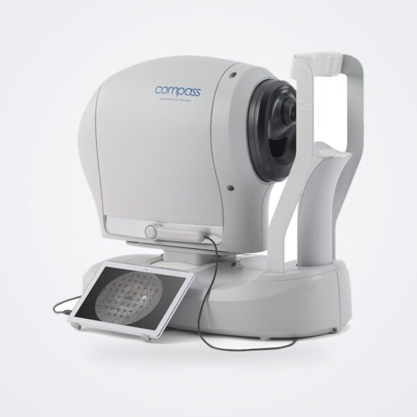 iCare COMPASS fundus automated perimeter, side view with headrest and tablet showing a test grid