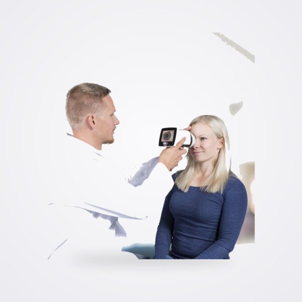 Clinician using the Optomed Aurora camera with anterior segment module on a seated patient