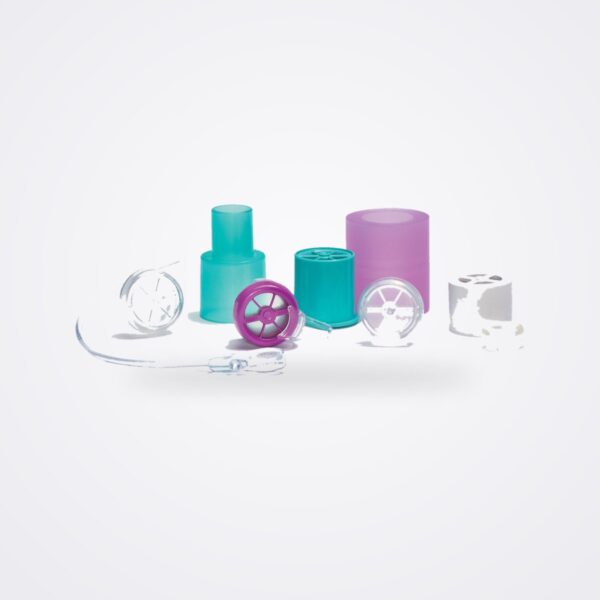 Passy Muir valve family: purple PMV 2001, aqua PMV 007, clear and white valves with adapters