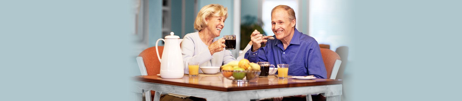Thick-It Original and Clear Advantage Food & Beverage Thickeners 3 Older couple sharing breakfast with drinks at a dining table, Thick It lifestyle image